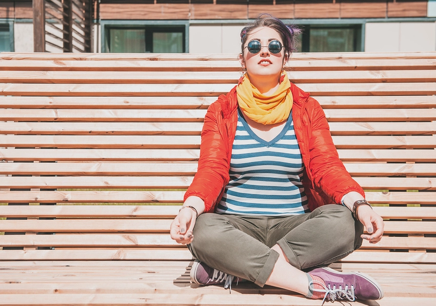 Beautiful Fashion Hipster Woman Doing Yoga On The Bench